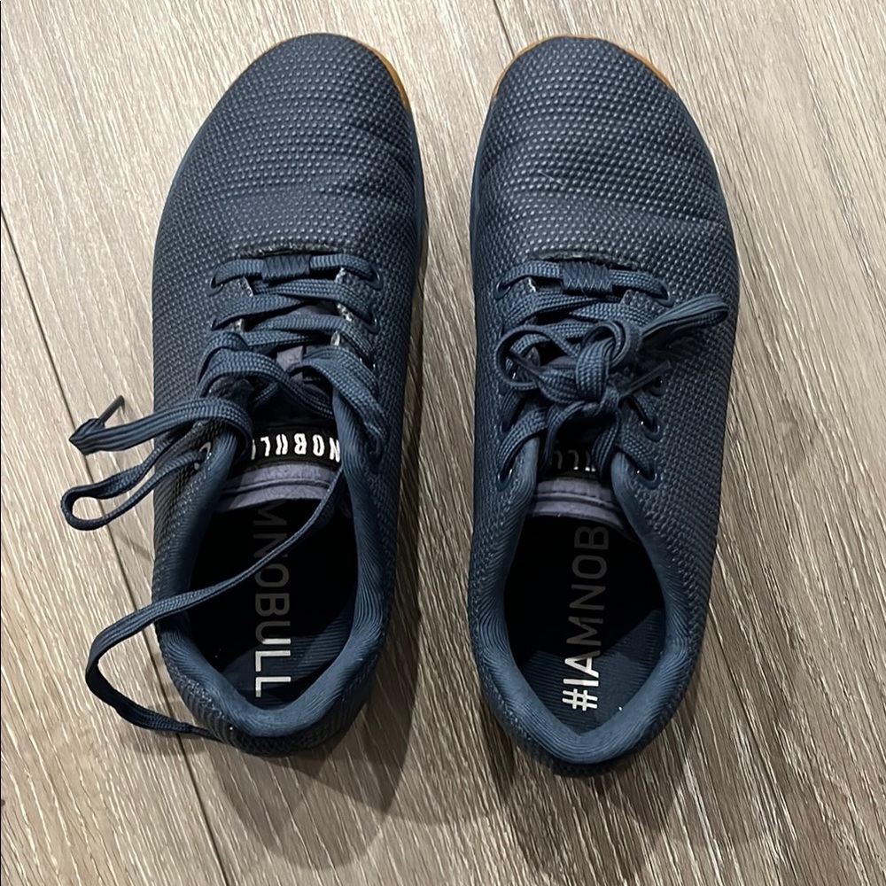 NOBULL Black Athletic Shoes with Breathable Fabric and Sleek Design